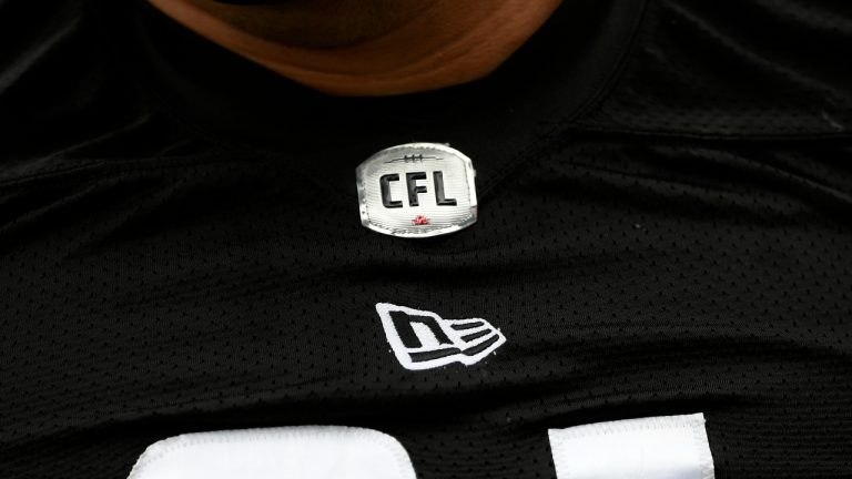 The CFL logo is seen on a jersey during the Redblacks training camp in Ottawa on Thursday, May 19, 2022. (Justin Tang/CP)