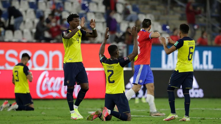 Ecuadorian players celebrate at full-time after defeating Chile in World Cup qualifying in Santiago. (AP Photo)