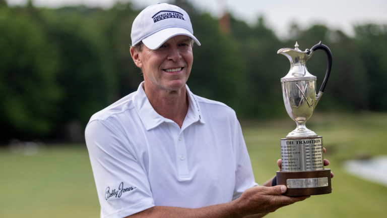 Steve Stricker poses with the trophy on the 18th hole after winning the the Regions Tradition, a PGA Tour Champions golf event, Sunday, May 15, 2022, in Birmingham, Ala. (AP)