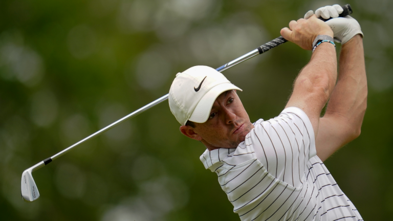 Rory McIlroy, of North Ireland, watches his tee shot on the 12th hole during a practice round for the PGA Championship golf tournament, Tuesday, May 17, 2022, in Tulsa, Okla. (AP)