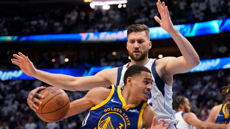 Golden State Warriors guard Jordan Poole controls the ball next to Dallas Mavericks forward Maxi Kleber (42) during the second half of Game 4 of the NBA basketball playoffs Western Conference finals, Tuesday, May 24, 2022, in Dallas. (AP)