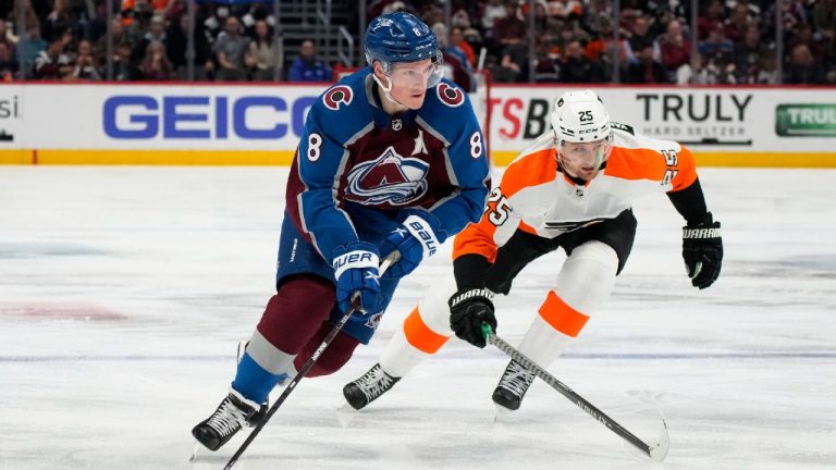 Colorado Avalanche defenseman Cale Makar, left, drives past Philadelphia Flyers left wing James van Riemsdyk during the third period of an NHL hockey game Friday, March 25, 2022, in Denver. (David Zalubowski/AP)