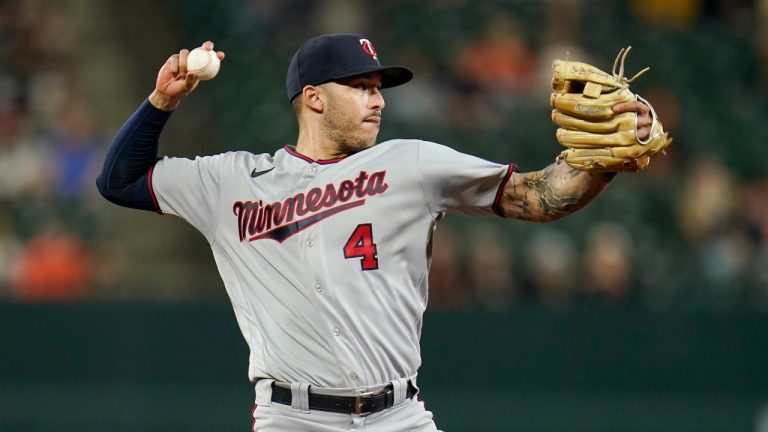 Minnesota Twins shortstop Carlos Correa throws out a Baltimore Orioles runner at first base during the ninth inning of a baseball game, Monday, May 2, 2022, in Baltimore. The Twins won 2-1. (AP)