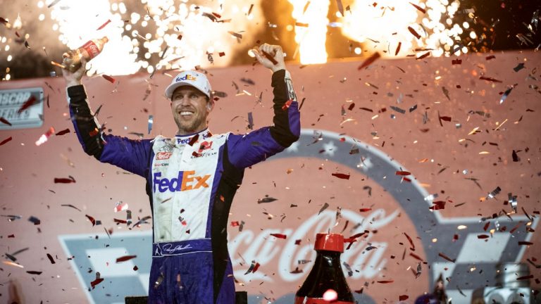 Denny Hamlin celebrates in Victory Lane after winning a NASCAR Cup Series auto race at Charlotte Motor Speedway, Sunday, May 29, 2022, in Concord, N.C. (Matt Kelley/AP)