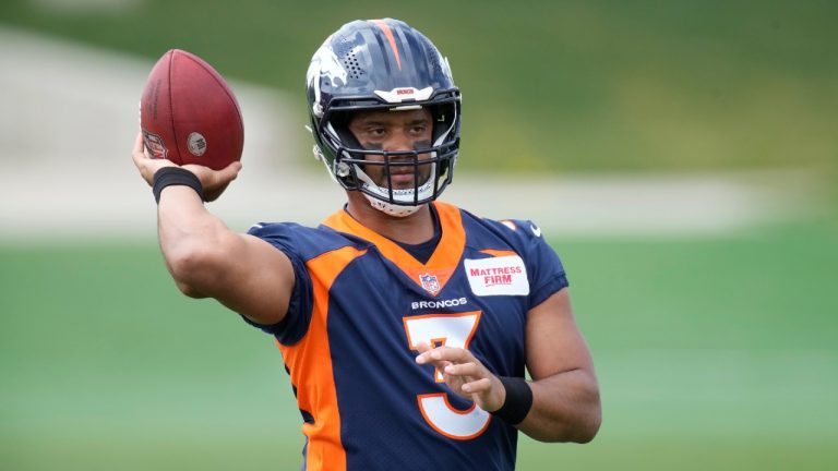 Denver Broncos quarterback Russell Wilson takes part in drills during a voluntary veteran minicamp football practice Tuesday, April 26, 2022, at the team's headquarters in Englewood, Colo. (David Zalubowski/AP)