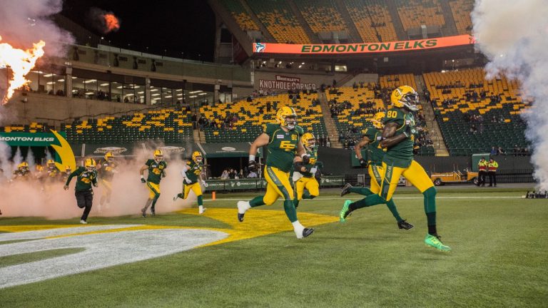 Edmonton Elks take the field against the Saskatchewan Roughriders. (Amber Bracken/CP)