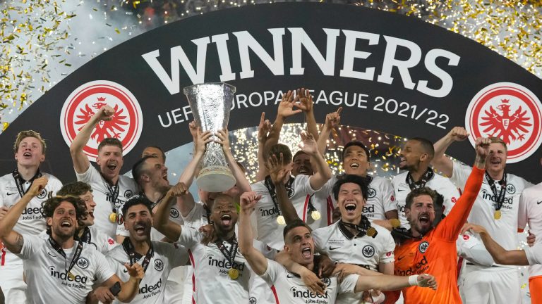 Frankfurt players celebrate with the trophy after winning the Europa League final soccer match between Eintracht Frankfurt and Rangers FC at the Ramon Sanchez Pizjuan stadium in Seville, Spain, Wednesday, May 18, 2022. Frankfurt defeated Rangers 5-4 in a penalty shootout after the game ended tied 1-1. (Manu Fernandez/AP)