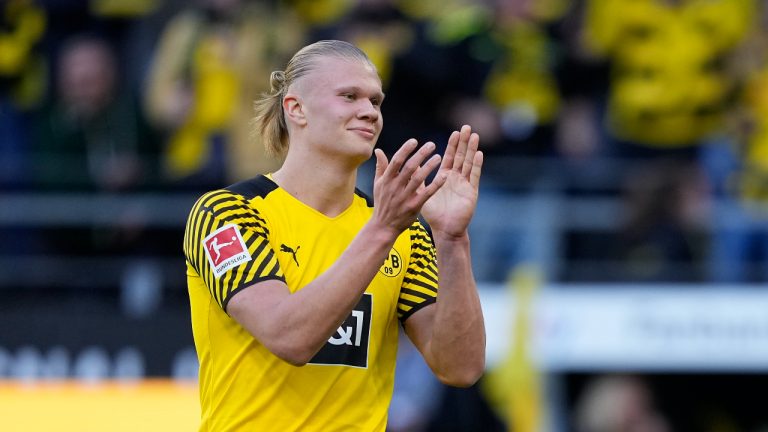 Dortmund's scorer Erling Haaland celebrates after he scored his side's 5th goal during the German Bundesliga soccer match between Borussia Dortmund and VfL Wolfsburg in Dortmund, Germany, Saturday, April 16, 2022. (Martin Meissner/AP)