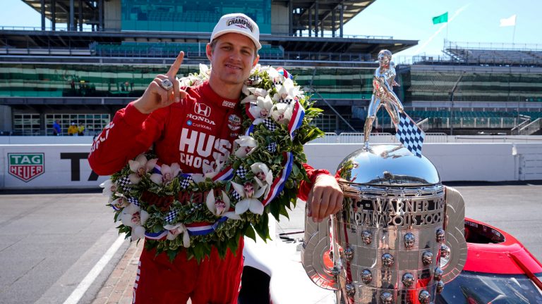 Marcus Ericsson, of Sweden, poses with the Borg-Warner Trophy during the traditional winners photo session at Indianapolis Motor Speedway in Indianapolis, Monday, May 30, 2022. Ericsson won the 106th running of the Indianapolis 500 auto race Sunday. (Michael Conroy/AP)