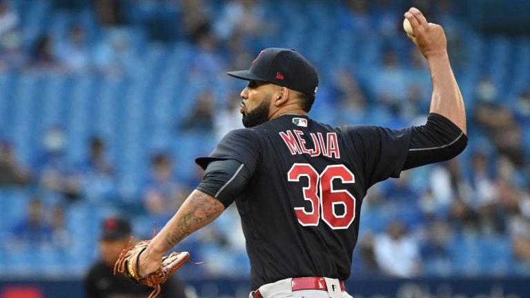 J. C. Mejia pitches during first inning AL baseball game action against the Toronto Blue Jays. (Jon Blacker/CP)