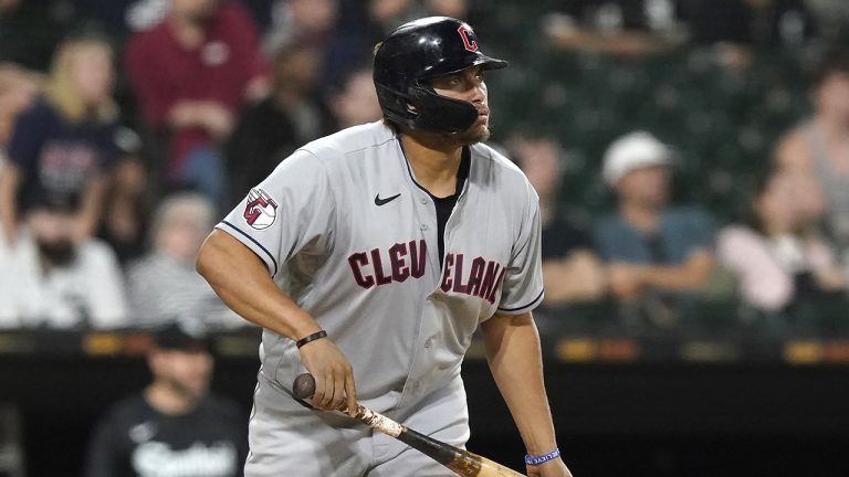 Cleveland Guardians' Josh Naylor watches his three-run home run off Chicago White Sox relief pitcher Ryan Burr during the 11th inning of a baseball game. (Charles Rex Arbogast/AP)