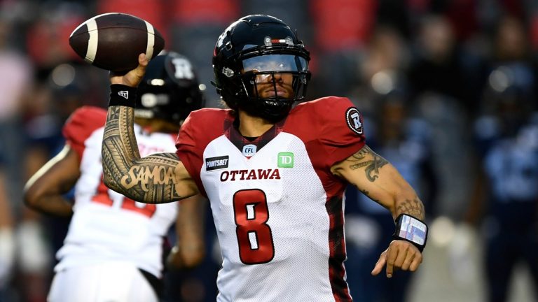 Ottawa Redblacks quarterback Jeremiah Masoli (8) throws the ball during first half of preseason CFL football action against the Toronto Argonauts in Ottawa on Friday, May 27, 2022.  (Justin Tang/CP)