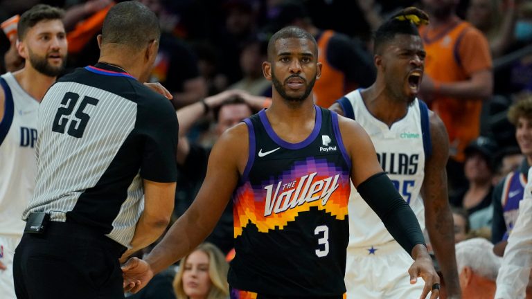 Phoenix Suns guard Chris Paul (3) and Dallas Mavericks forward Reggie Bullock, right, react after Paul was called for a foul during the first half of Game 2 of an NBA basketball second round playoff series, Wednesday, May 4, 2022, in Phoenix. (Matt York/AP)