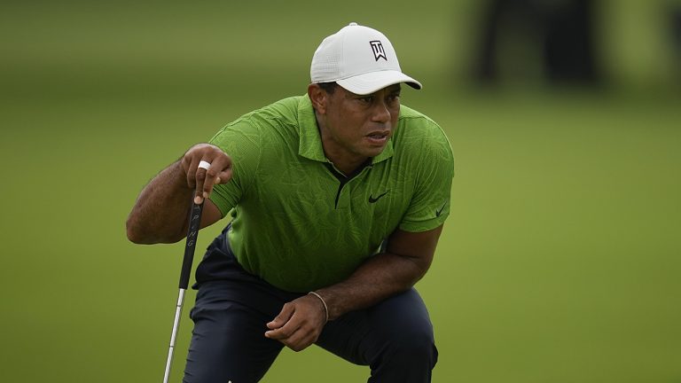Tiger Woods lines up a putt on the third hole during the second round of the PGA Championship golf tournament at Southern Hills Country Club. (Sue Ogrocki/AP)
