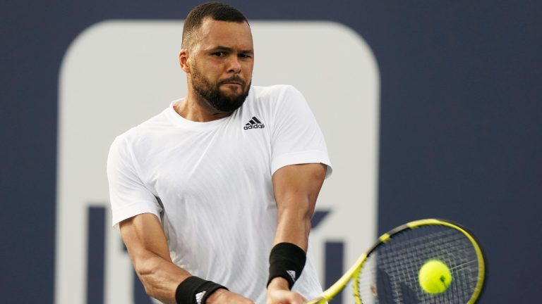 Jo-Wilfried Tsonga, of France, returns to Jordan Thompson, of Australia, during the Miami Open tennis tournament Thursday, March 24, 2022, in Miami Gardens, Fla. (Marta Lavandier/AP)