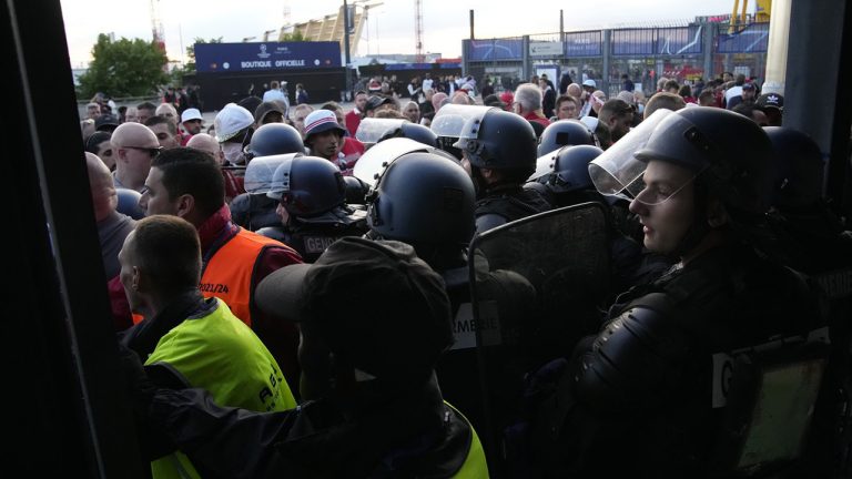 Police officers guard the Stade de France prior the Champions League final soccer match between Liverpool and Real Madrid, in Saint Denis near Paris, Saturday, May 28, 2022. Police deployed tear gas on supporters waiting in long lines to get into the Stade de France for the Champions League final between Liverpool and Real Madrid that was delayed by 37 minutes while security struggled to cope with the vast crowd and fans climbing over fences. (Christophe Ena/AP)