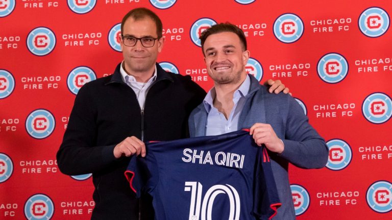 Chicago Fire midfielder Xherdan Shaqiri, right, posing with sporting director Georg Heitz, left, in February, has become the highest paid player in MLS. (Brian Cassella/AP)