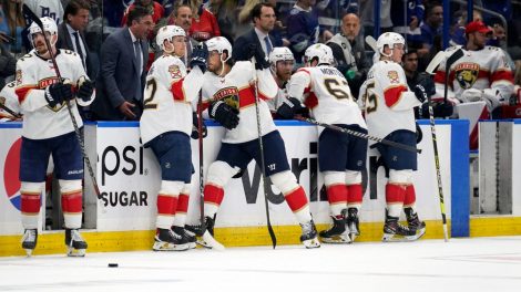 Members-of-the-Florida-Panthers-wait-during-a-video-review