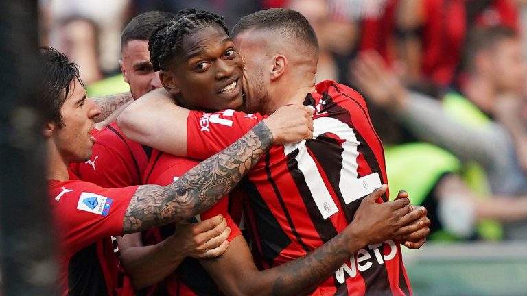 AC Milan's Rafael Leao, center, celebrates after scoring during the Serie A soccer match between AC Milan and Fiorentina, at the Milan San Siro stadium, Italy, Sunday, May 1, 2022. (Spada/LaPresse via AP)