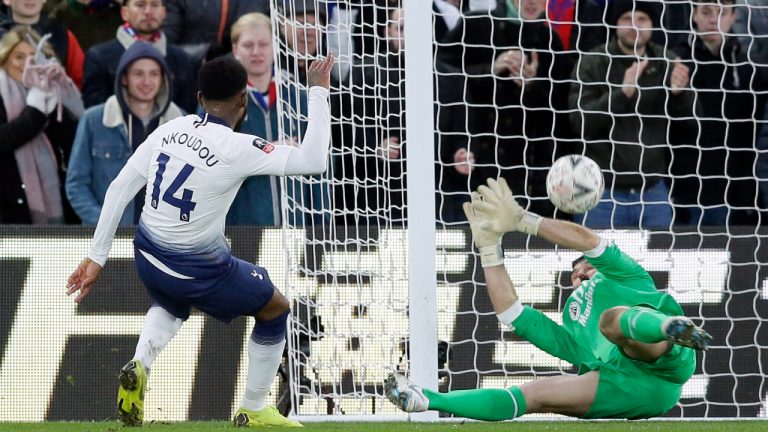 Crystal Palace goalkeeper Julian Speroni blocks a shot from Tottenham's Georges-Kevin Nkoudou, left, during an English FA Cup fourth round soccer match between Crystal Palace and Tottenham Hotspur at Selhurst Park in London, Sunday, Jan. 27, 2019. (Tim Ireland/AP)
