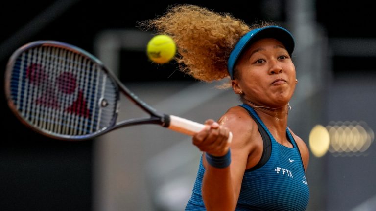 Naomi Osaka of Japan returns the ball against Sara Sorribes Tormo, of Spain, during their match at the Mutua Madrid Open tennis tournament in Madrid, Spain, Sunday, May 1, 2022. (Manu Fernandez/AP)