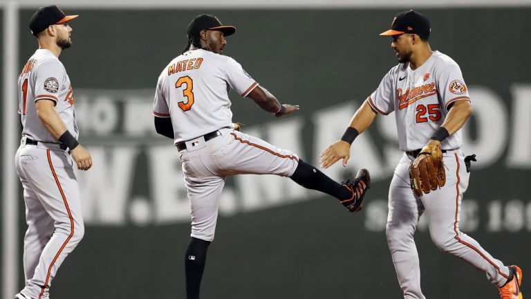 Baltimore Orioles' Jorge Mateo (3) celebrates with Chris Owings (11) and Anthony Santander (25) after defeating the Boston Red Sox in a baseball game. (Michael Dwyer/AP)