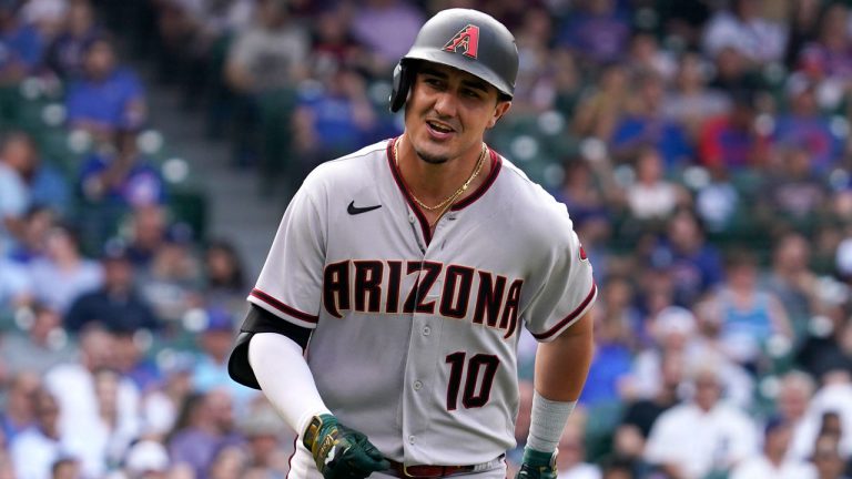 Arizona Diamondbacks' Josh Rojas smiles as he rounds the bases after hitting a solo home run during the seventh inning of a baseball game against the Chicago Cubs. (Nam Y. Huh/AP)