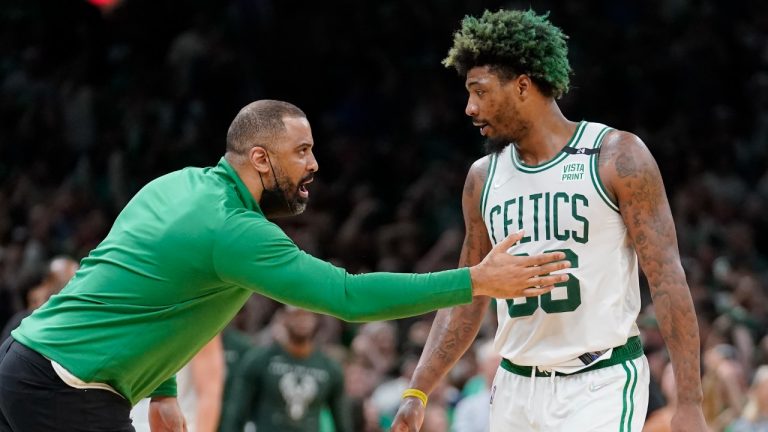Boston Celtics head coach Ime Udoka, left, speaks with Celtics guard Marcus Smart, right, as the team leads the Milwaukee Bucks during the second half of Game 7 of an NBA basketball Eastern Conference semifinals playoff series, Sunday, May 15, 2022, in Boston. (Steven Senne/AP)