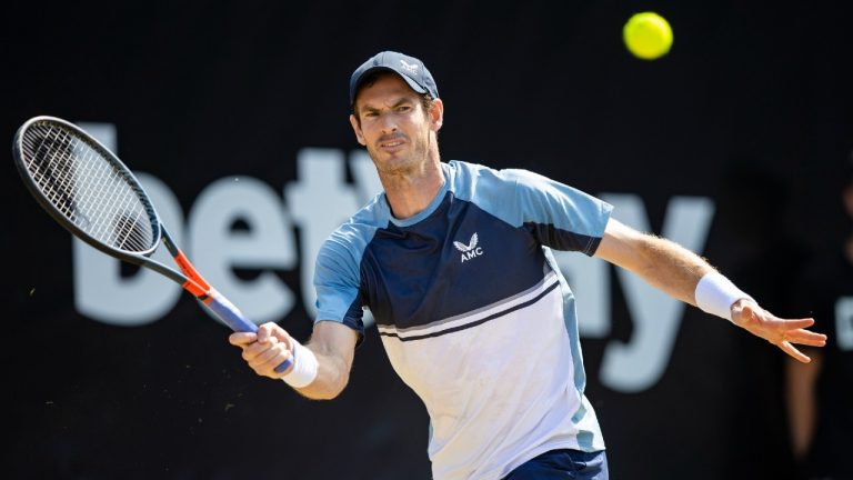 Britain's Andy Murray returns the ball to Australia's Nick Kyrgios during their ATP tennis semifinals match in Stuttgart, Germany, Saturday, June 11, 2022. (Tom Weller/dpa via AP)