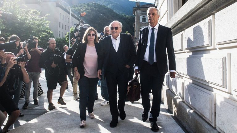 The former president of the World Football Association (Fifa), Joseph Blatter, center, accompanied by his daughter Corinne Blatter, left, and his lawyer Lorenz Erni, right, arrives at the Swiss Federal Criminal Court in Bellinzona, Switzerland, Wednesday, June 8, 2022. Blatter and the former president of the the European Football Association (UEFA), Michel Platini, will stand trial before the Federal Criminal Court from Wednesday, over a suspicious two-million payment. (Alessandro Crinari/Keystone via AP)