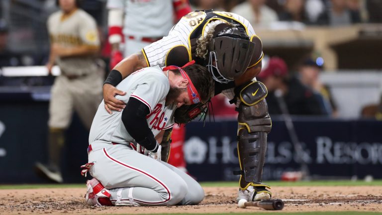 Philadelphia Phillies' Bryce Harper, bottom, reacts after being hit by a pitch from San Diego Padres' Blake Snell as Padres catcher Jorge Alfaro checks on him duirng the fourth inning of a baseball game. (Derrick Tuskan/AP)