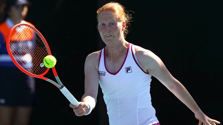 Alison Van Uytvanck of Belgium plays a forehand return to Wang Qiang of China during their second round match at the Australian Open tennis championships in Melbourne, Australia, Wednesday, Jan. 19, 2022. (Tertius Pickard/AP)