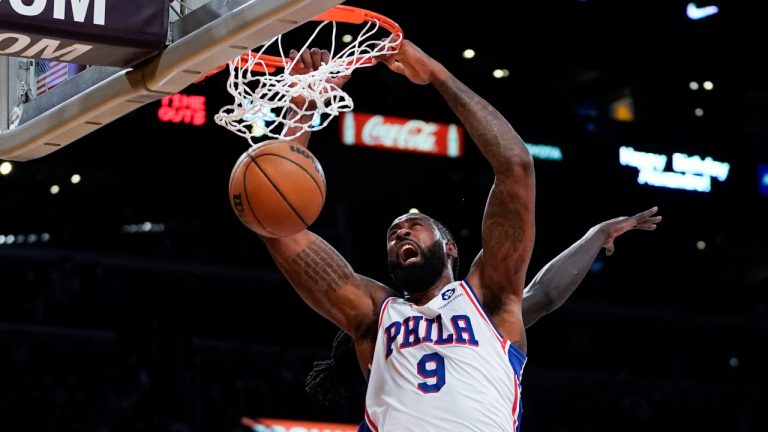 Philadelphia 76ers center DeAndre Jordan (9) dunks against center Dwight Howard (39) during the second half of an NBA basketball game in Los Angeles, Wednesday, March 23, 2022. (AP Photo/Ashley Landis)