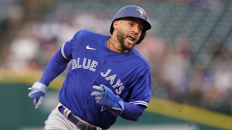 Toronto Blue Jays' George Springer heads home to score during the first inning of a baseball game against the Detroit Tigers, Friday, June 10, 2022, in Detroit. (AP Photo/Carlos Osorio)