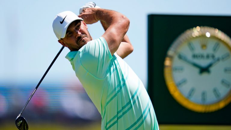 Brooks Koepka hits on the 13th hole during a practice round for the U.S. Open golf tournament at The Country Club, Wednesday, June 15, 2022, in Brookline, Mass. (AP Photo/Julio Cortez)