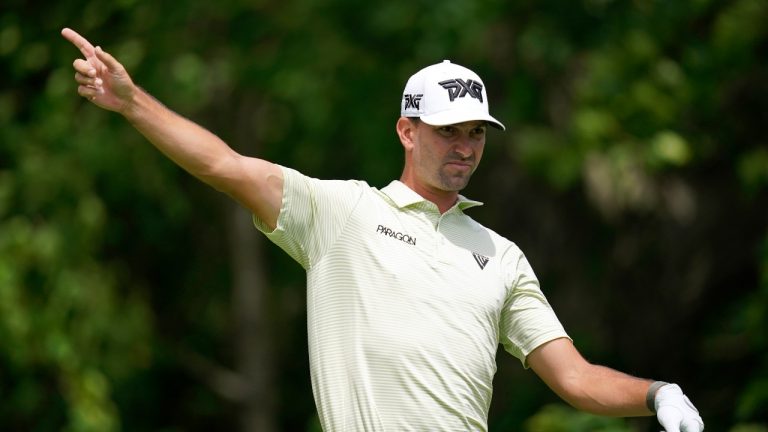 Michael Gligic, of Canada, reacts after his shot on the second tee during the first round of the John Deere Classic golf tournament, Thursday, June 30, 2022, at TPC Deere Run in Silvis, Ill. (Charlie Neibergall/AP Photo)