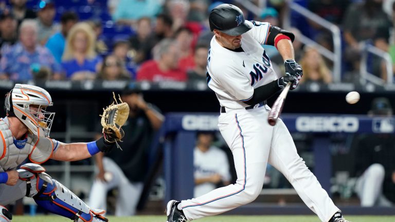 Miami Marlins' Nick Fortes hits a walk-off solo home run during the ninth inning of a baseball game against the New York Mets, Sunday, June 26, 2022, in Miami. The Marlins won 3-2. At left is New York Mets catcher James McCann. (Lynne Sladky/AP)