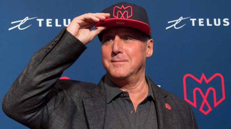Gary Stern the new co-owner of the Montreal Alouettes poses with a cap during a news conference in Montreal, Monday, January 6, 2020. (Graham Hughes/CP)