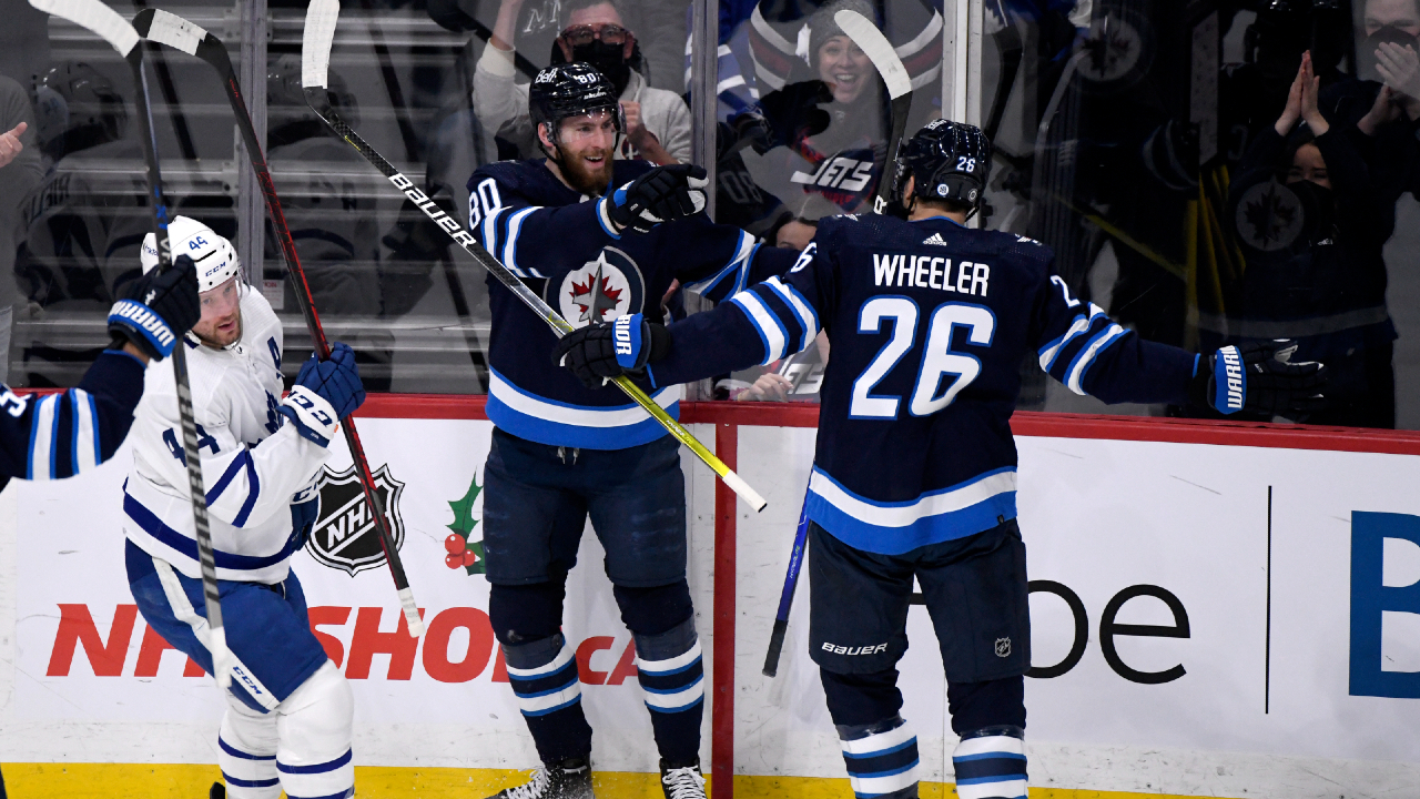 Winnipeg Jets' Pierre-Luc Dubois (80) celebrates his goal against the Toronto Maple Leafs with Blake Wheeler (26) during first period NHL action in Winnipeg, Sunday, Dec. 5, 2021. (Fred Greenslade/CP)