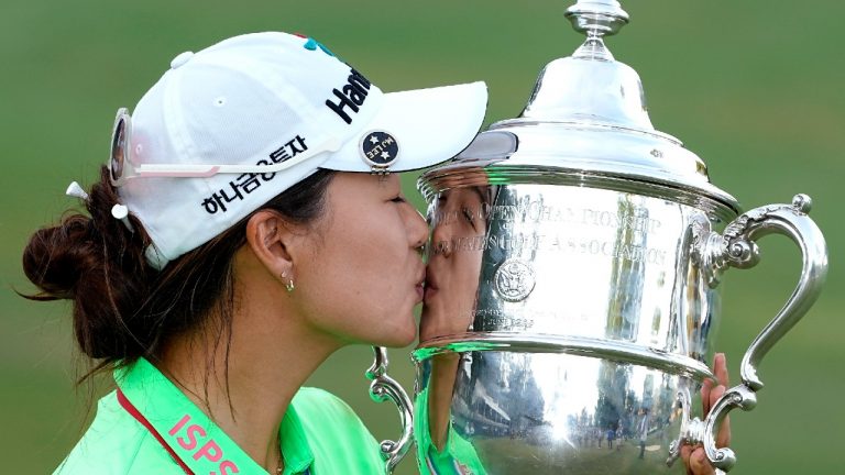 Minjee Lee, of Australia, kisses the Harton S. Semple Trophy after winning the U.S. Women's Open golf tournament at the Pine Needles Lodge & Golf Club in Southern Pines, N.C., on Sunday, June 5, 2022. (Steve Helber/AP)