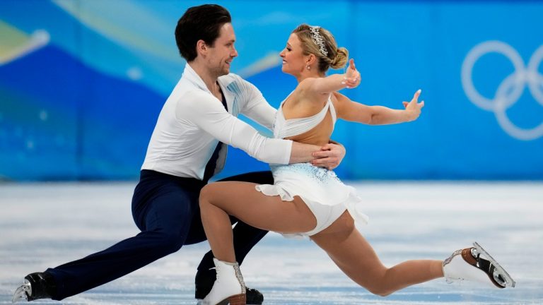 Kirsten Moore-Towers and Michael Marinaro, of Canada, compete in the pairs free skate program during the figure skating competition at the 2022 Winter Olympics, Saturday, Feb. 19, 2022, in Beijing. (Natacha Pisarenko/AP)