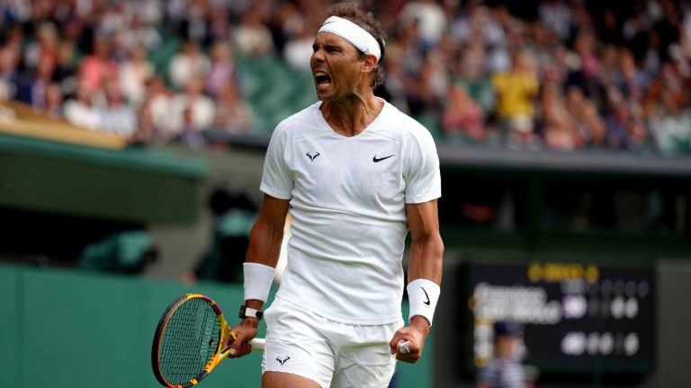 Spain's Rafael Nadal celebrates beating Argentina's Francisco Cerundolo in a first round men's singles match on day two of the Wimbledon tennis championships in London, Tuesday, June 28, 2022. (John Walton/PA via AP)