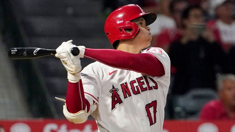 Los Angeles Angels' Shohei Ohtani follows through as he hits a two-run home run during the fifth inning of a baseball game against the Boston Red Sox. (Mark J. Terrill/AP)