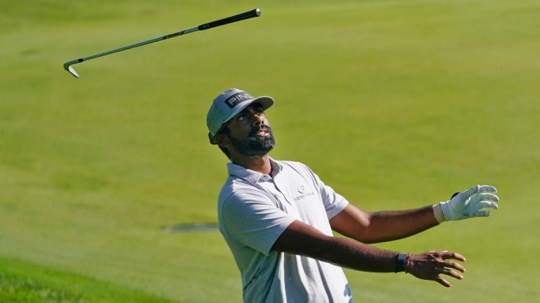 Sahith Theegala throws his club while after hitting on the 18th hole during the third round of the Travelers Championship golf tournament at TPC River Highlands, Saturday, June 25, 2022, in Cromwell, Conn. (Seth Wenig/AP)