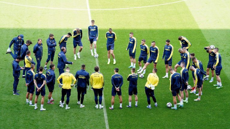 Ukraine players form a circle during a training session at the Cardiff City Stadium, Cardiff, Wales Saturday June 4, 2022, the day before the team play Wales in a World Cup play-off soccer match. (Mike Egerton/AP)