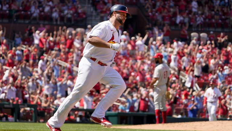St. Louis Cardinals' Albert Pujols, left, rounds the bases after hitting a solo home run off Philadelphia Phillies relief pitcher Cristopher Sanchez, right, during the sixth inning of a baseball game Sunday, July 10, 2022, in St. Louis. (Jeff Roberson/AP)