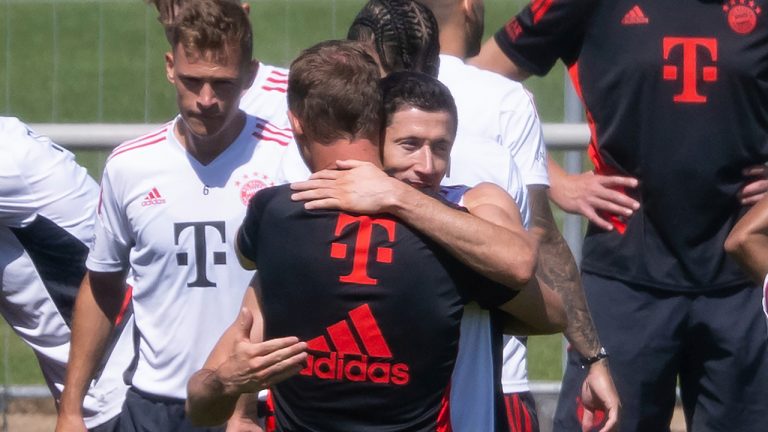 Robert Lewandowski and coach Julian Nagelsmann of Munich say goodbye at the end of training, in Munich, Germany, Saturday, July 16, 2022. Barcelona is set to sign Poland striker Robert Lewandowski from Bayern Munich after the clubs reached an agreement in principle for his transfer, a person with knowledge of the negotiations tells The Associated Press. The person, who spoke under anonymity because he was not allowed to speak publicly about the deal, said that the official confirmation of the deal could come on Saturday. (Sven Hoppe/dpa via AP)