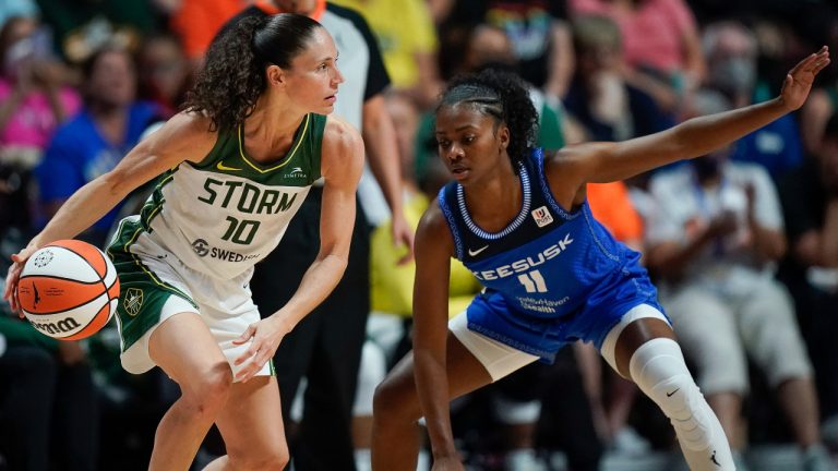 Seattle Storm guard Sue Bird (10) is defended by Connecticut Sun guard Nia Clouden (11) during the second half of the WNBA basketball game Thursday, July 28, 2022, in Uncasville, Conn. (AP Photo/Bryan Woolston)