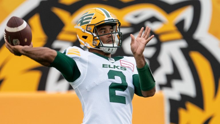 Edmonton Elks quarterback Tre Ford (2) throws during warm-up prior to CFL football game action against the Hamilton Tiger Cats in Hamilton, Ont., Friday, July 1, 2022. (Peter Power/THE CANADIAN PRESS)