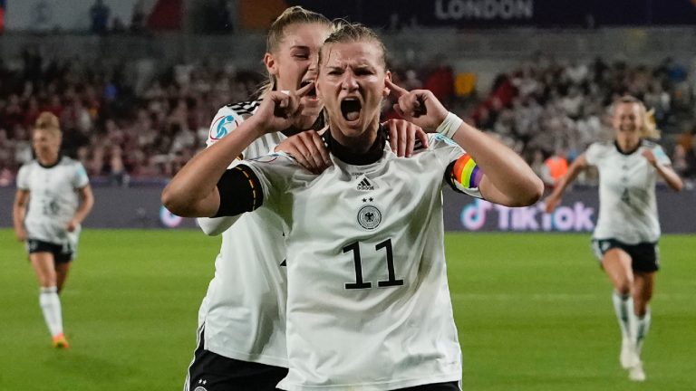 Germany's Alexandra Popp celebrates with Jule Brand, centre left, after scoring her side's second goal during the Women Euro 2022 quarter final soccer match between Germany and Austria at Brentford Community Stadium in London, Thursday, July 21, 2022. (Alessandra Tarantino/AP)